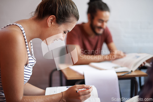 Image of Woman, exam and writing in college, learning and knowledge on campus for education. Student, female person and notes for information in book, planning and research for studying or revision in profile