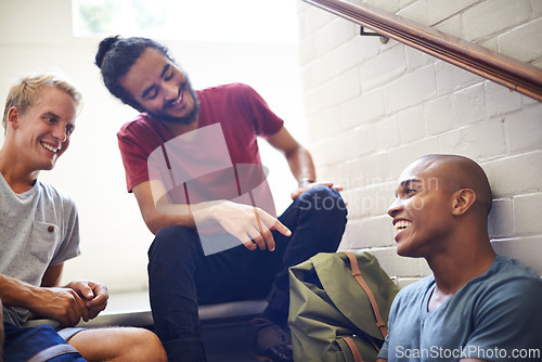 Image of Campus, stairs and students with smile, backpack and laughing together as friends, classmates and conversation. University, school and men in course for education with scholarship, relax and people