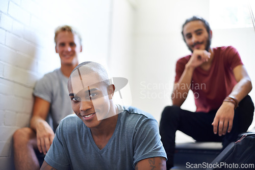 Image of Black student, classmates and happy with portrait on staircase for conversation at recess, break and campus. Diverse people, talking and relax on steps in hallway at college between lecture or class.