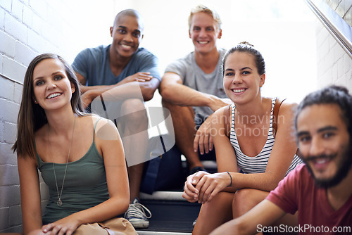 Image of Students, diversity and group of people, stairs and campus for friends and support. Smile, university and happy learners before lecture of class, academic and teamwork for project or studying