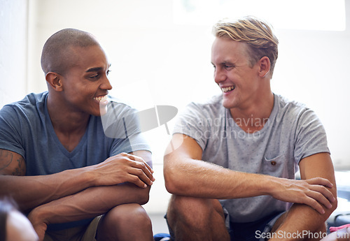 Image of Male student, diversity and laugh on campus stairs, education and smile before lecture. College, funny and joke in conversation between friends, teamwork and partners for project and study for exam