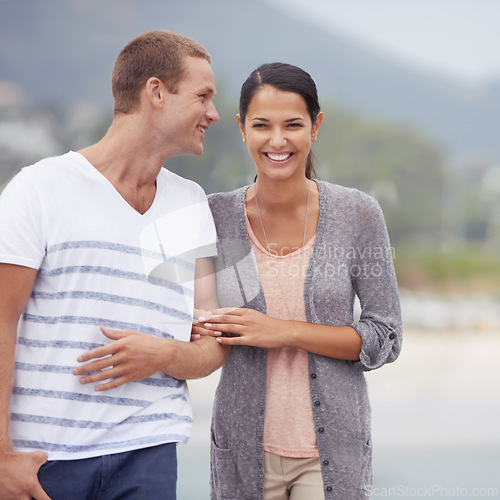 Image of Couple, hug and walking together on the beach for travel, laughter and happiness outdoor. Romantic adventure, love and comedy for bonding, support and trust with commitment on holiday in Mexico