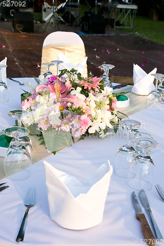 Image of Detail of party table with flowers.