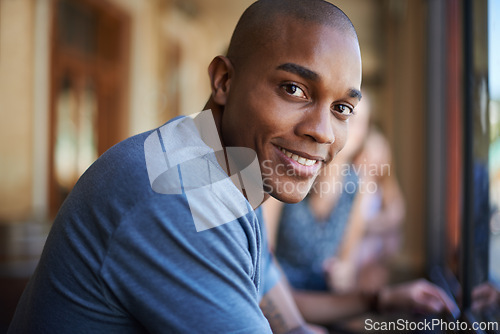 Image of Portrait, smile and a black man at cafe to relax, cheerful and positive face for leisure at restaurant in Kenya. Facial, cafeteria and happy African person or young customer in casual clothes at shop