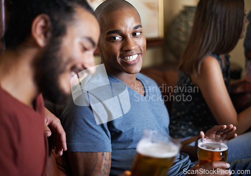 Image of Friends, beer and happy at pub, smile and relax indoor for drink and bonding in summer to destress. Male people, pub and chill for social, guys and alcohol together and laughing for fun and weekend.