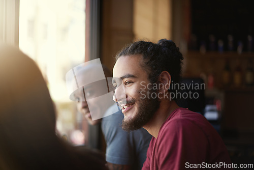 Image of Face, smile and man with friends in coffee shop together for conversation or bonding on weekend. Customer, relax and summer with group of happy young friends in cafe or restaurant for time off