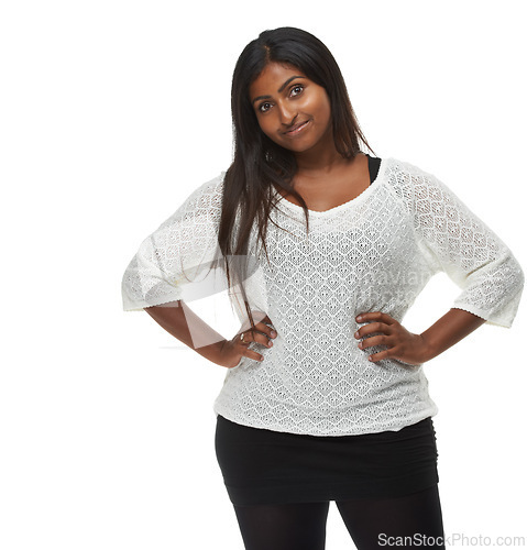 Image of Indian woman, fashion and portrait in studio with style, pride and trendy outfit by white background. Girl, person or model with edgy clothes, smile and happy for confidence, pride and casual shirt