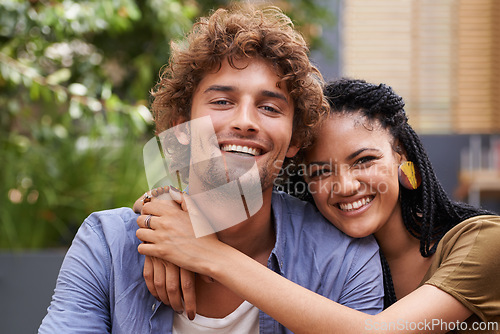 Image of Portrait, couple and lovers with embrace, smile and love outdoors in garden, backyard and patio. Male person, black woman and interracial partners with diversity, affection and bonding in Jamaica