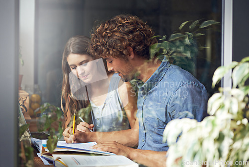 Image of Man, woman and research for writing, education and tutor in cafe in urban indoor bistro. Couple, journalist and copywriter for window, college and reading for knowledge and love for date together