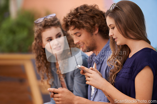 Image of Students, college and phone with woman, friends and outdoor for browsing social media and happy mates. Research, scrolling and people for learning, ebook and online at scholarship with smile
