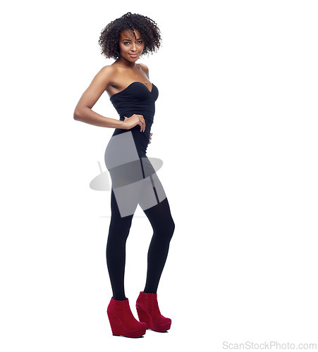 Image of Black woman, portrait and fashion with high heels in studio, edgy stylish outfit for style and hair isolated on white background. Haircare, curls or afro with confident pose and chic designer clothes