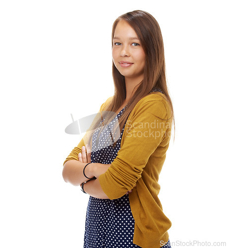 Image of Studio, portrait and confident student with arms crossed, trendy and commitment to education by white background. English woman, pride and positive face in style and ready to study in casual fashion