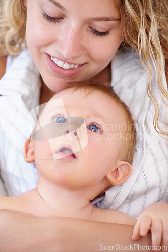 Image of Baby, bonding and happy with mother, relaxing and love together with child and care for motherhood. Infant, mom and smile for affection, nurture and home for growth and babysitting with family