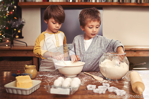 Image of Kids, baking and playing in kitchen with flour, home and bonding with ingredients for dessert cake. Children, mixing and bowl for cookies on counter, eggs and boys learning of pastry recipe by butter