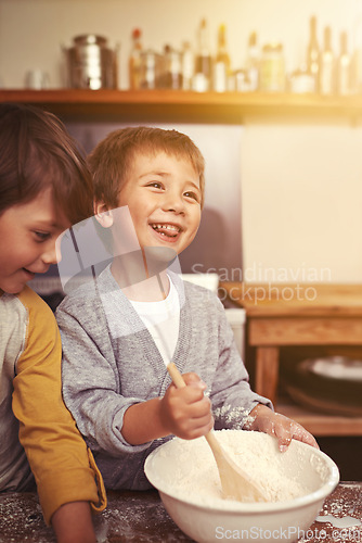 Image of Happy, kitchen and children baking in home with ingredients, flour and mixing bowl for cookie dough. Utensils, siblings and learning for holiday, pastry recipe and dessert cake by lens flare.
