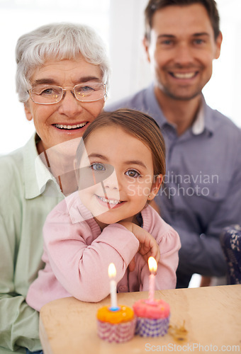 Image of Cupcakes, candles and girl with birthday, family and grandmother with happiness, candy and home. Childhood, celebration and dad with dessert or joy with party or smile with wow, sweet or surprise