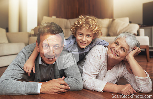 Image of Floor, smile and grandparents with grandson in living room, together and love with happiness. Old people, grandmother and grandpa in house as seniors in retirement, elderly and bonding with boy