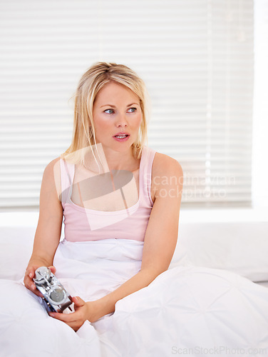 Image of Woman, alarm clock and frustrated for waking up in bed, tired and sleepless or fatigue at home. Female person, exhausted and pressing or hit snooze in apartment, late and annoyed or lazy and fail