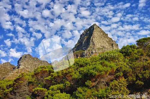 Image of Mountains, environment and blue sky with nature, summer and stone with landscape and weekend break. Empty, rock and grass with flowers and countryside with spring and travel with holiday or sunshine