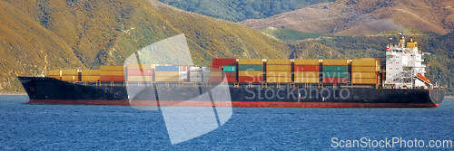 Image of Shipping, container and ocean for transportation, logistics and supply chain industry, worldwide and global delivery. Freight export, cargo and banner of a ship travelling on sea for commercial trade