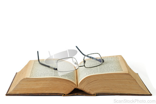 Image of Old, book or glasses with manuscript of knowledge, ancient literature or history on a white studio background. Closeup of historic novel or spectacles for vintage scripture or reading on mockup space