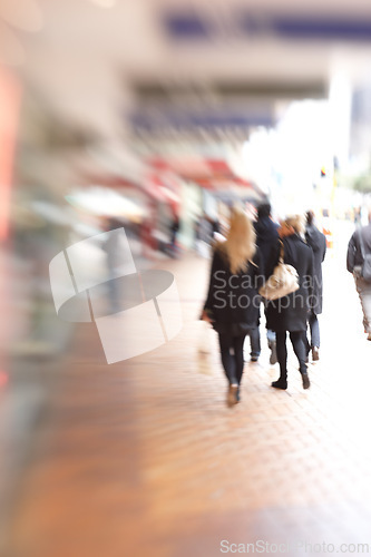 Image of Blur, city and people are walking outdoor, town square for travel or commute with back view. Motion, moving and journey in urban New York street, adventure and day trip in metro with busy sidewalk