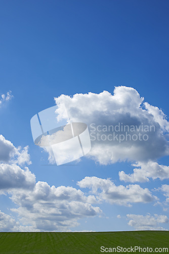 Image of Blue sky, clouds and nature at countryside with environment, sustainability and mockup in summer. Beauty, nature and zen field with grass for growth, eco friendly and horizon with lawn on earth