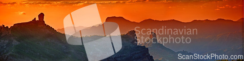 Image of Landscape, sunset and panorama view of mountains, Gran Canaria Island with nature skyline and environment. Orange sky, horizon and natural background with travel location or destination in Spain