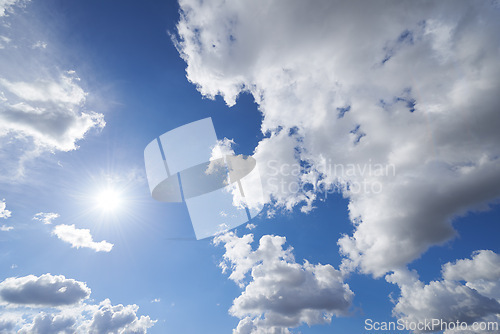 Image of Sun, cloud and blue sky with heaven or nature for hope, faith or natural outdoor scenery. Sunny day, cloudy fog and sphere of sunshine, celestial ball or bright orb in the air for summer or weather