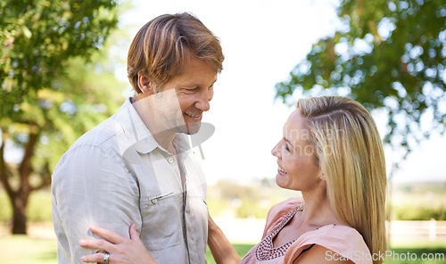 Image of Couple, relax and happy in nature with love on honeymoon date, bonding and anniversary vacation. Face, man and woman with smile outdoor at park together for healthy relationship and summer holiday