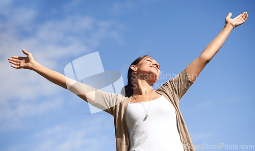 Image of Smile, freedom and blue sky in summer with woman hands raised outdoor in fresh air of nature. Environment, happy or relax and young person satisfied with travel, vacation or holiday from below