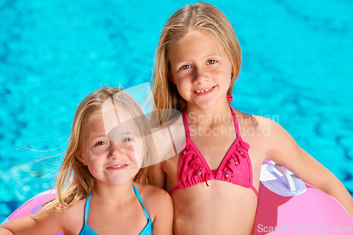 Image of Summer, portrait and kids with inflatables at swimming pool for adventure at resort on vacation. Holiday, games or friends relax together with toys for fun in water, activity or children with fashion