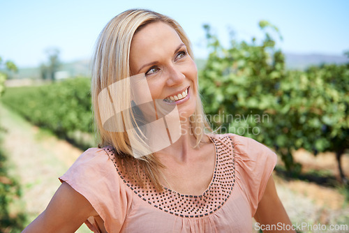 Image of Mature, woman and vineyard with smile, thinking and nature for relaxation and sunshine. Person, summer and farm for rest, break and happiness with sustainable agriculture and holiday or vacation