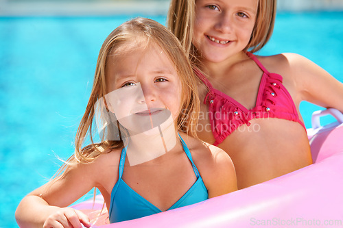 Image of Happy, portrait and kids with inflatables in swimming pool for adventure at resort on vacation. Holiday, games or friends relax together with toys for fun in water, summer or children with fashion