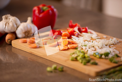 Image of Chopped veggies, cutting board and meal prep for chef, restaurant and bistro for healthy eating. Food, kitchen and nutrition for lunch, dinner and home cooking cuisine for diet or vegan appetite