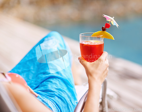 Image of Closeup, hand and cocktail on summer vacation for fun, relax and drink at hotel pool in Bangkok. Woman, swimwear and alcoholic beverage to toast for me time at peaceful, luxury and holiday resort