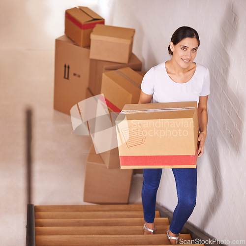 Image of Portrait, smile and woman with boxes for moving, real estate and new home by stairs. Happy person, cardboard and relocation to property at steps in house, apartment and loan for mortgage of owner