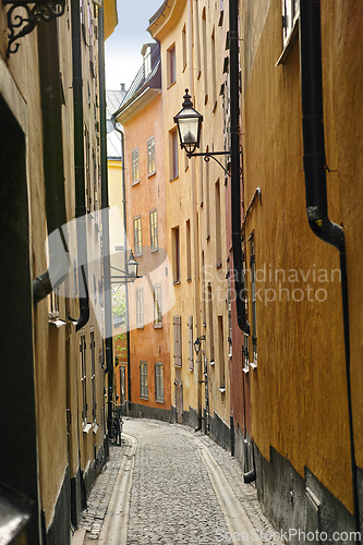 Image of Travel, architecture and buildings on vintage alley with history, culture or holiday destination in Sweden. Vacation, old road and antique stone street in Stockholm with cobble path in ancient city