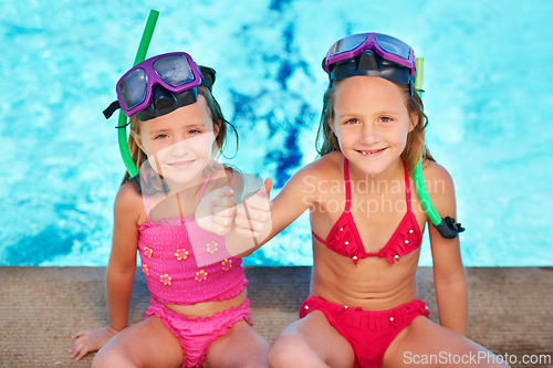 Image of Portrait, girls and happy children with thumbs up at swimming pool, sisters or siblings outdoor together to relax in summer. Smile, kids and like by water for vacation, holiday and family in swimsuit