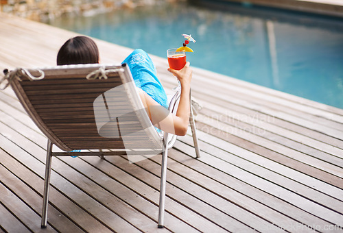 Image of Woman, lounge chair and cocktail on summer vacation for fun cheers, relax and drink at hotel pool. Female tourist, alcoholic beverage or toast to peace, me time and luxury holiday resort in Maldives