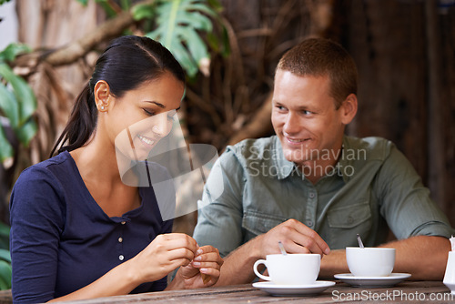 Image of Restaurant, coffee and couple with conversation, love and customers with relationship and marriage. Cafe, relaxing and man with woman and morning with weekend break and bonding together with people