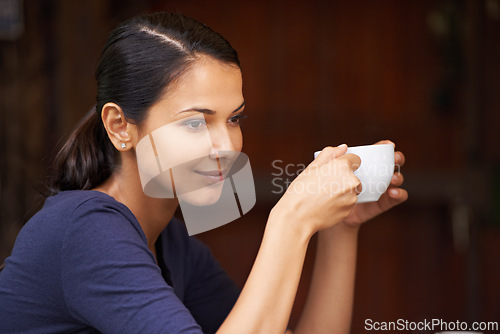 Image of Woman, cafe and coffee with thinking, relax and smile for break and happiness. Customer, restaurant and mug with ideas, positivity and caffeine planning weekend outdoor with tea or beverage alone
