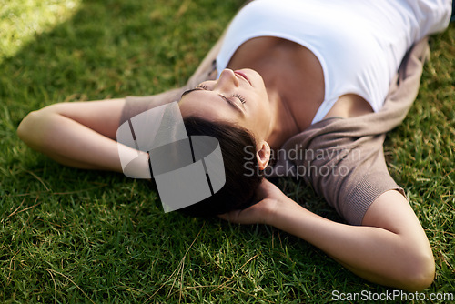 Image of Relax, sleep and woman on grass of field, nature or park outdoor in summer for fresh air or free time. Environment, peace and wellness with calm young person lying on lawn in backyard to rest