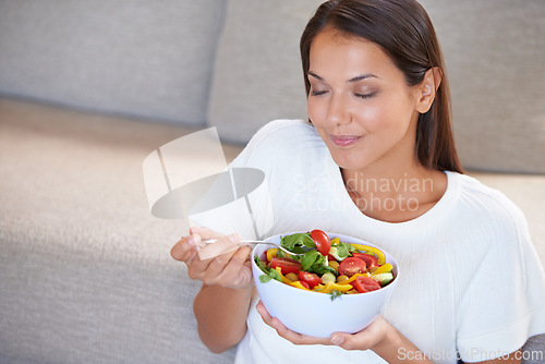 Image of Health, eating and young woman with salad for organic, wellness and fresh diet lunch. Food, vegetables and female person enjoying vegan produce meal, dinner or supper for nutrition benefits at home.