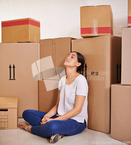 Image of Woman, moving and boxes in living room for real estate, property investment and mortgage of new apartment. Homeowner, tired and female person with cardboard for home loan, relocation or renovation.