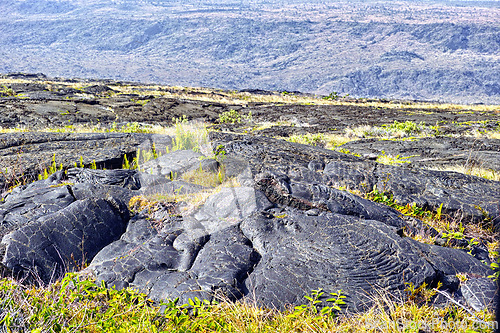 Image of Nature, mountain rocks and landscape background with dry lava for destination, environment and outdoor adventure. Countryside, tourism and scenery for eco friendly, journey and explore in Hawaii.