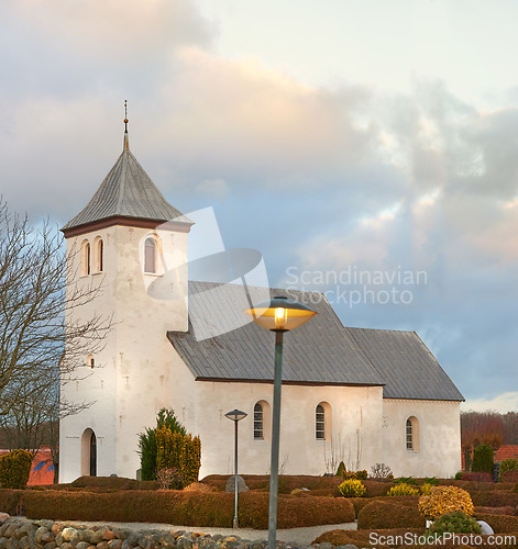 Image of Cloud, tree or chapel in autumn for worship, faith and hope on Sunday evening service in Copenhagen. Sky, church and bushes for spiritual, trust and god for prayer, religion and silver lining