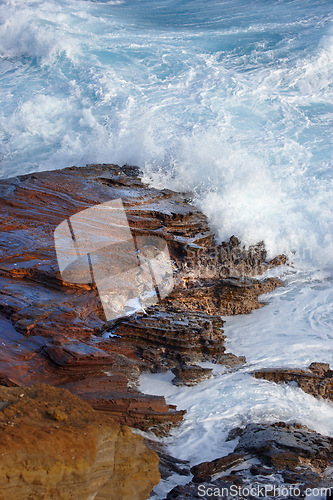 Image of Beach, water and travel with freedom, vacation or summer holiday, seascape or adventure in nature. Ocean, rock or boulder in Portugal for tropical paradise, peace or relax with stress relief at sea