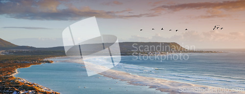 Image of Water, drone and beach sunset with peace, beauty and location tranquility in nature. Aerial view, freedom and ocean sunrise for summer, travel or vacation, holiday or stress relief in South Africa