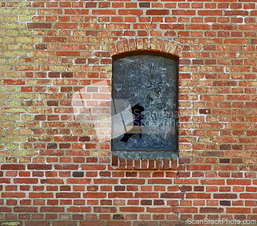 Image of Old, broken window and exterior with brick wall of abandoned house, building or concrete frame. Historic outdoor texture of rubble, glass crack or damage from war, wreck or destruction in vandalism